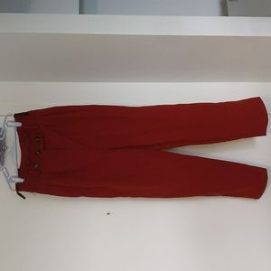 Topshop brick red trousers with tortoiseshell buttons, size 4.